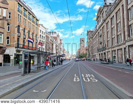 Amsterdam, The Netherlands - 03 October, 2021: People Walking In The Nieuwezijds Voorburgwal Street.