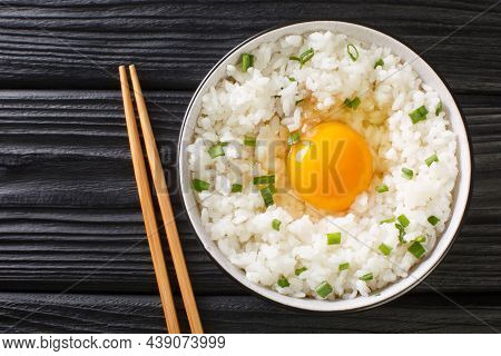 Tamago Kake Gohan Is A Simple Japanese Dish Made Of Raw Egg Over Rice Close Up In The Bowl On The Ta