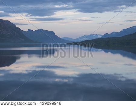 Beautiful Blue Pink Sunrise Over The Lake Lulealven In Saltoluokta In Sweden Lapland. Reflection Of 