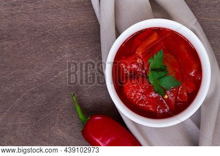 Lecho Of Tomatoes And Sweet Paprika With Ingredients On The Table. Lecso National Dish Of Hungarian 