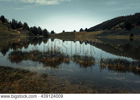 Lake Of The Confins And Mountain Landscape At Sunrise. La Clusaz, Haute-savoie, France