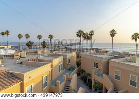 View Of Roof Decks Of Complex Buildings With Beach Waterfront At Oceanside, California