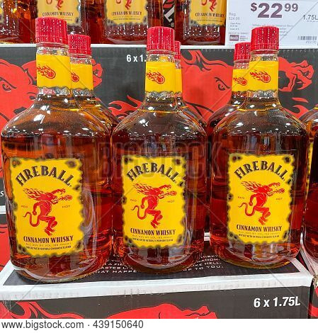 A Display Of Bottles Of Fireball Cinnamon Whisky  With Background Bokeh At A Binneys Liqour Store In
