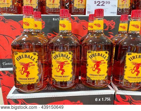 A Display Of Bottles Of Fireball Cinnamon Whisky  With Background Bokeh At A Binneys Liqour Store In