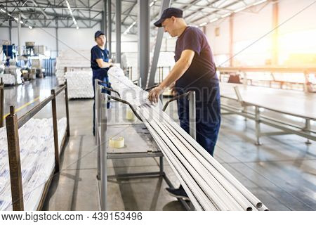 Factory Workers Engineer Checks The Quality Of Polypropylene Pipes