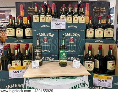 A Display Of Bottles Of Jameson Irish Whiksey  With Background Bokeh At A Binneys Liqour Store In Sp
