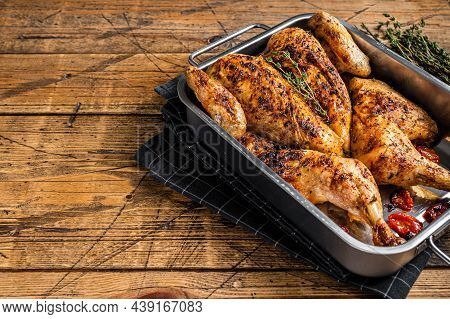 Homemade Chicken Rotisserie With Thyme In Baking Dish. Wooden Background. Top View. Copy Space