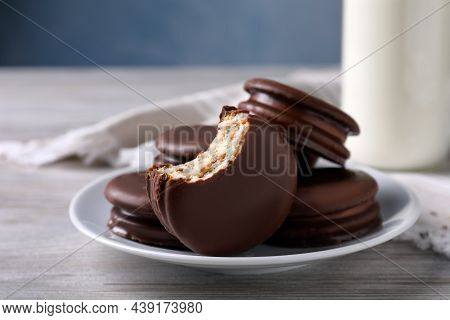Tasty Choco Pies And Milk On White Wooden Table