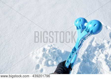 Children Toy Is A Tool For Modeling Snowballs From Snow. Blue Color Plastic Device. Winter Outdoor K