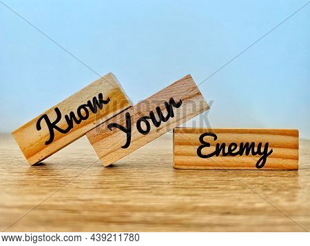 Know Your Enemy Text On Wooden Bricks