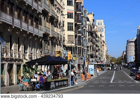 Barcelona, Spain - October 7, 2021: People Walk In Eixample District In Barcelona, Spain. Barcelona 