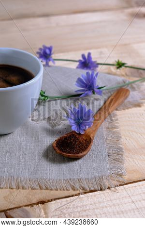 Chicory Drink In A White Cup And Powder In A Wooden Spoon. Useful Healthy Drink. Substitute For Coff