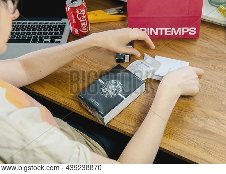 Paris, France - Jan 27, 2019: Woman Unboxing Unpacking New Perfume Box Luxury French Diptyque Brand 