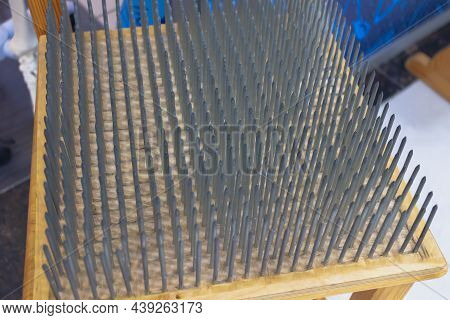 The Seat Is Made Of Sharp Nails. A Lot Of Nails Are Driven Into The Chair. The Concept Of Overcoming