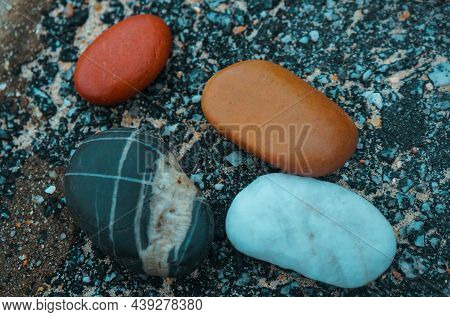 Photo Of Beautiful Multi-colored Stones That Lie On The Shore.