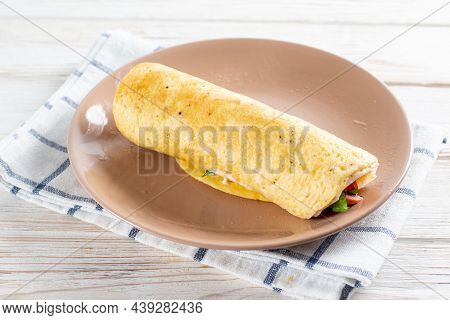 Cooking An Egg Roll. Popular Egg Roll With Cheese And Tomatoes. Selective Focus