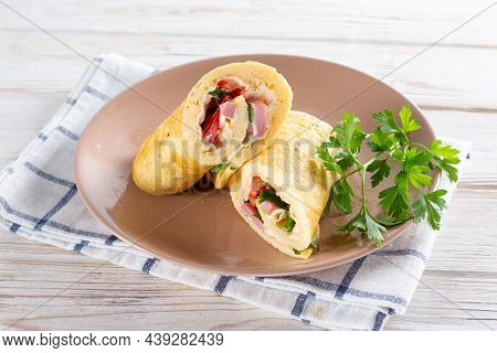 Cooking An Egg Roll. Popular Egg Roll With Cheese And Tomatoes. Selective Focus