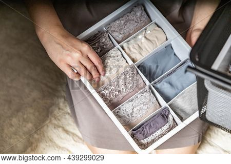 Top View Female Hands Comfortable Boxes Storage For Panties, Socks, Bras Konmari Method Storage