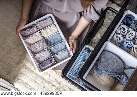 Top View Female Hands Comfortable Boxes Storage For Panties, Socks, Bras Konmari Method Storage