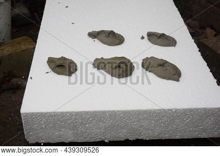 Polystyrene Foam Board External Wall Insulation. Applying Adhesive On The Rigid Polystyrene Insulati