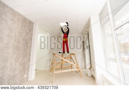 Builder Replacing Ceiling Panel, Working, Ceiling Armstrong