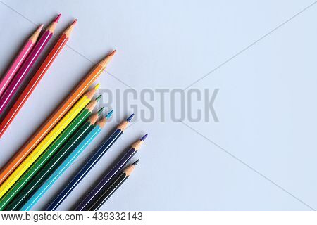 Color Pencils On A Light Gray Blue Background. Top View With Space For Text. Back To School Concept.