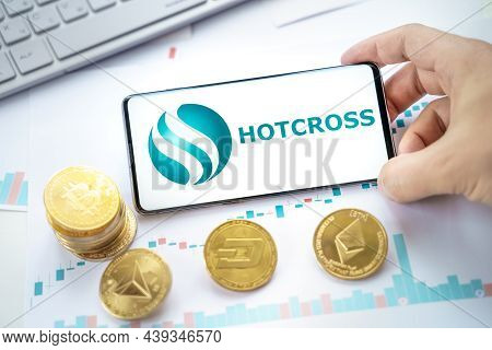 Russia Moscow 20.05.2021 Hotcross Logo In Mobile Phone.cryptocurrency Decentralized Exchange Dex.tra
