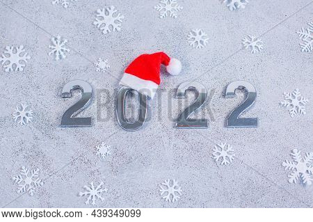 Silver Number 2022 With Hat Of Santa On Fastive Background