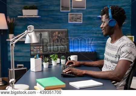 African American Videographer Editing Video Montage For Visual Effects Movie Project On Computer. Fi