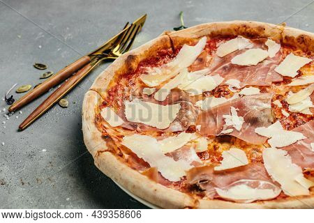 Sliced Pizza With Prosciutto Parma Ham And Parmesan Cheese. Italian Cuisine. Banner, Menu, Recipe Pl