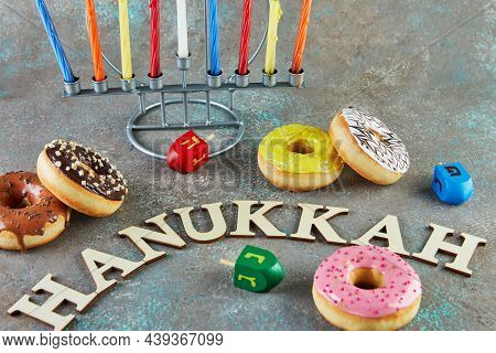 Happy Hanukkah And Hanukkah Sameach - Traditional Jewish Candlestick With Candles, Donuts And Spinni