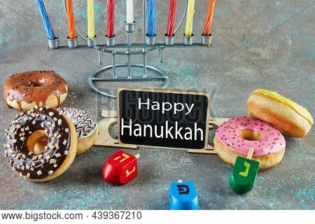 Happy Hanukkah And Hanukkah Sameach - Traditional Jewish Candlestick With Candles, Donuts And Spinni