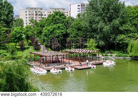Bucharest, Romania - 29 May 2021: Landscape With Lake And Vivid Green Trees In Drumul Taberei Park (