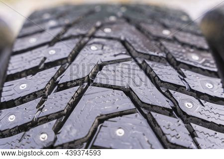 Winter Tires With Spikes On A Black Background Close-up, Safety During Winter Driving, Winter Tire P