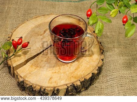 Mug With Rustic Red Rosehip Tea. Herbal Tincture Red Tea, Red Berry Homopathy