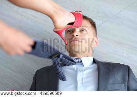 Woman Foot In High-heeled Shoes Stands On Man Head. Domination Of Women Over Men Concept
