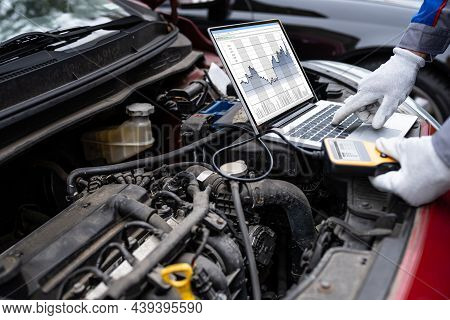 Car Diagnostic Service And Electronics Repair By Mechanic Worker