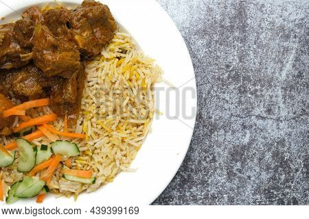 Close Up Picture Part Of Mutton Briyani On Stone Table. Famous Indian And Also Malay Food Serve Duri