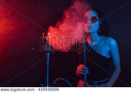 Hookah Atmosphere. The Girl Enjoys Smoking A Hookah, Sheesha.