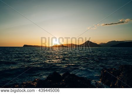 Setting Sun Behind The Mamula Island. Montenegro
