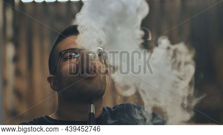 Arabic Jordanian Young Man Smokes A Hookah.
