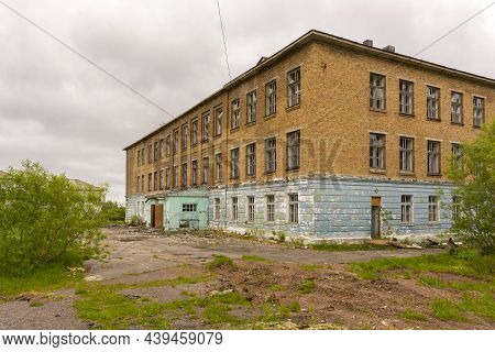 An Old Abandoned School In The Ghost Town Of Sovetsky. Abandoned Settlement. Vorkuta, Russia.
