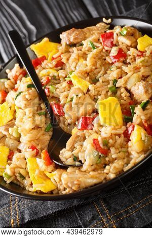 Peruvian Fried Rice With Meat And Eggs Arroz Chaufa Close Up In The Bowl On The Table. Vertical