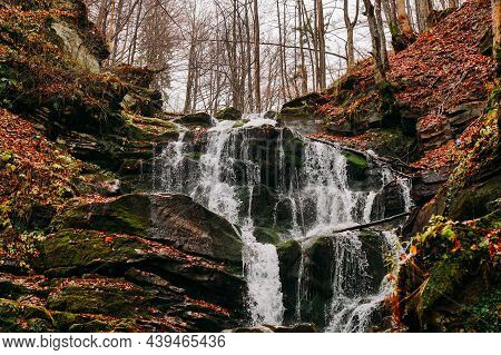 Carpathian Mountain Waterfall Shypot. Autumn Landscape With A Waterfall