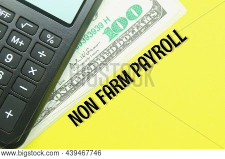 Calculator, Banknotes With The Words Non Farm Payroll