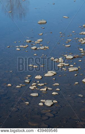 Stone At Water Level In A Beautiful River In The Canadian Countryside In Quebec