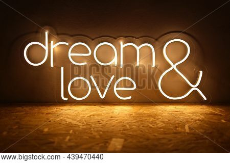 White Neon Sign With The Inscription Dream Love. Trendy Style. Wedding Design. Neon Sign. Custom Neo