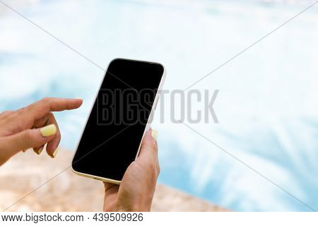 Female Hand Holding Smartphone And Typing With Index Finger. Closeup, Mock Up.