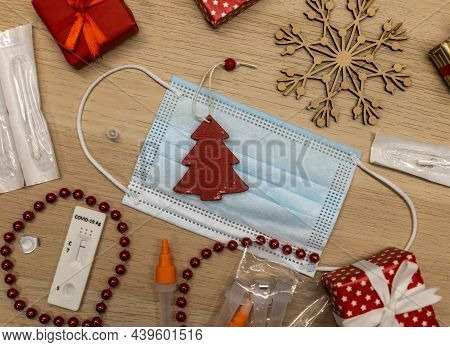Christmas Decoration And Covid Test With Mask On Table