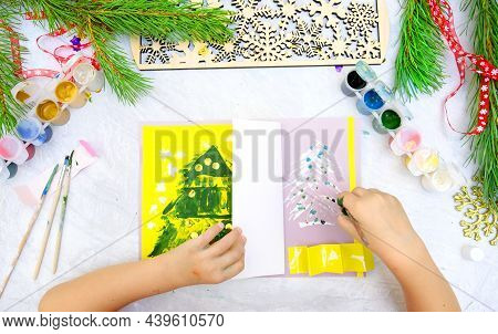 Child Making A Greeting Card,  Craft For Children, Nice Paper Card With Chrictmas Tree In Yellow Gra